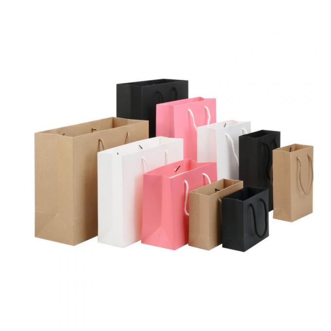 El empaquetado de lujo coloreado de la ropa del papel que hace compras 100g empaqueta la impresión de Flexo 1